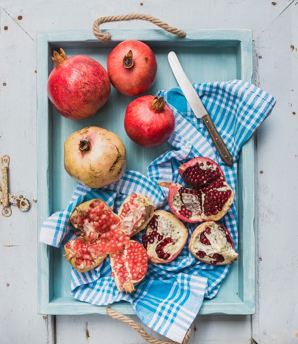 Pomegranate on a wooden tray