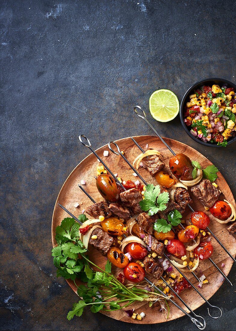 Beef and tomato skewers and a sweetcorn and onion salsa with dried tomatoes