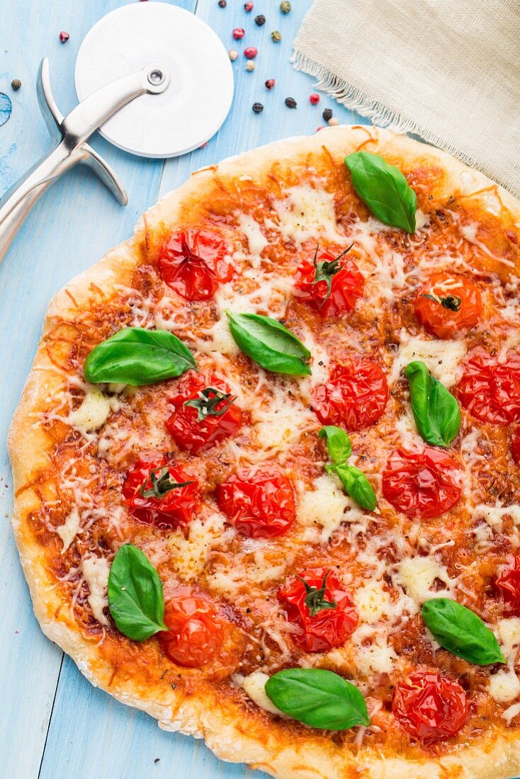 Cherry tomato, cheese and basil pizza