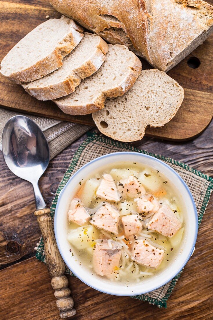 Delicious salmon soup with noodles in a bowl