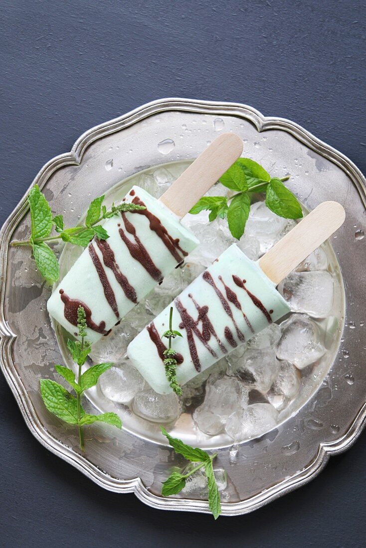 Ice cream mint popsicles drizzled with chocolate