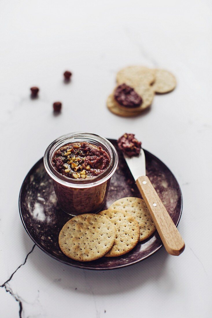 Homemade red chicory pesto in a jar