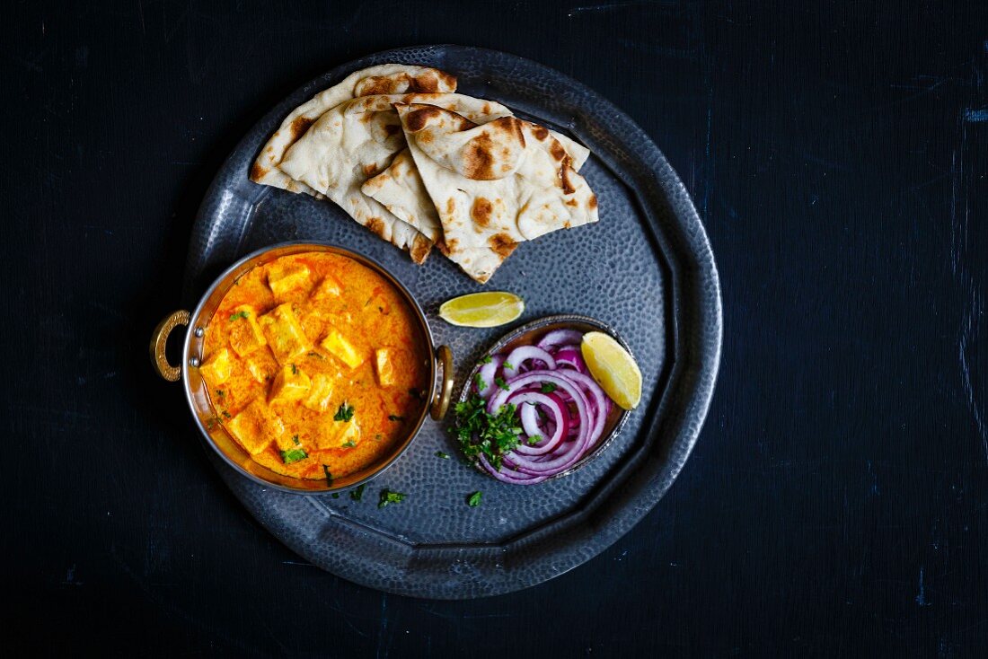 Paneer Butter Masala served with Nan and salad