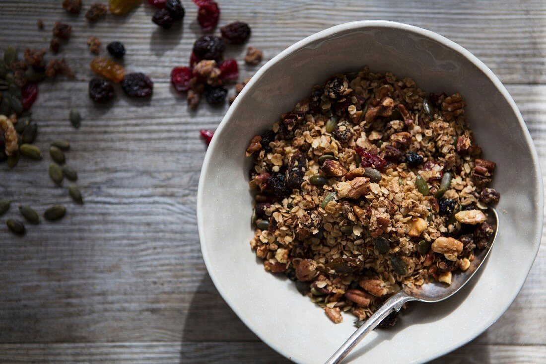 Bowl of Homemade Granola with Nuts, Seeds, Raisins and Cranberries