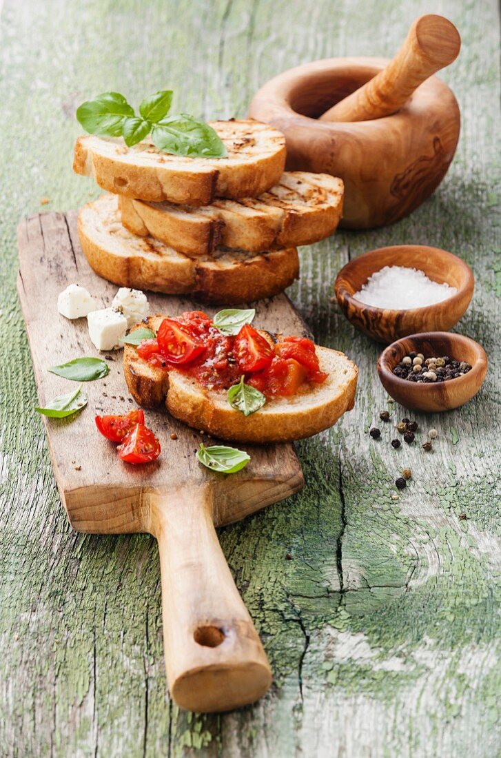 Italian bruschetta with chopped tomatoes, basil and oil on grilled crusty bread