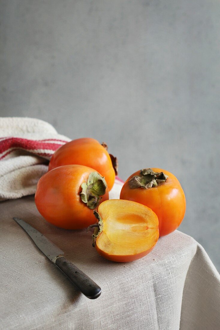 Still life with persimmon on a table