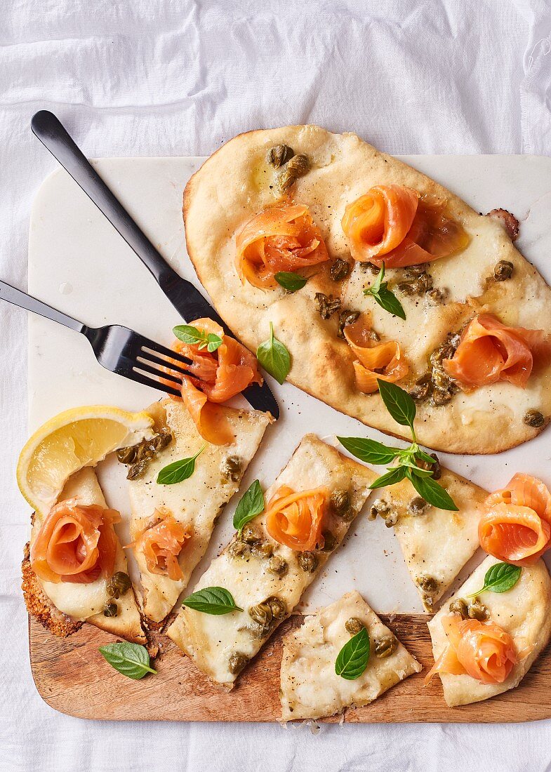 Naan pizzas with buffalo mozzarella, smoked trout and capers