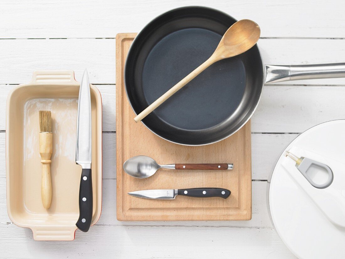 Various kitchen utensils: pan, salad bowl, casserole dish