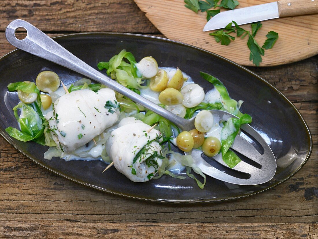 Plaice rolls with grapes and pointed cabbage