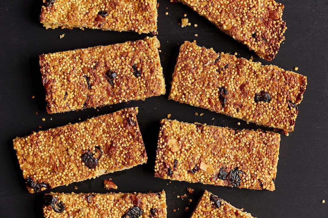 Millet bars with cranberries, banana and chopped almonds