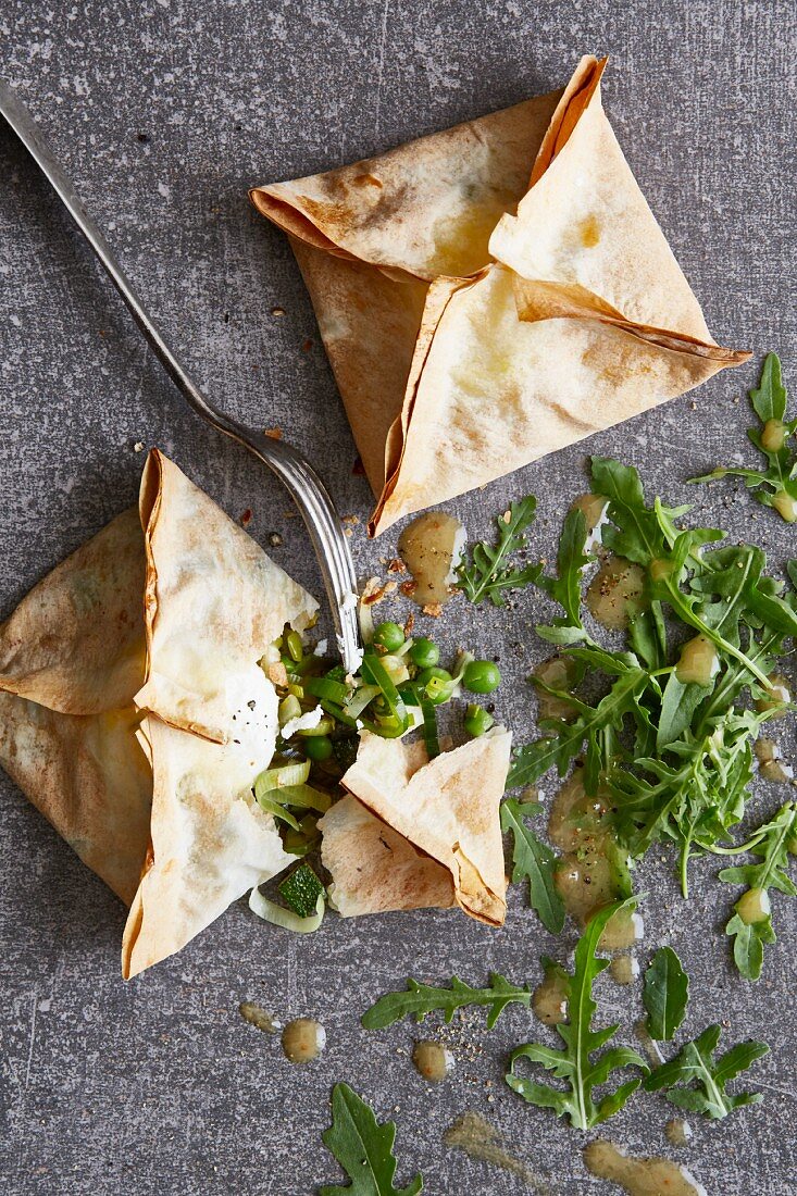 Filo pastry parcels filled with green vegetables and goat's cheese