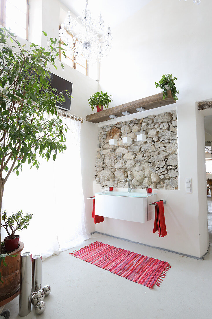 Exposed rustic masonry in renovated bathroom