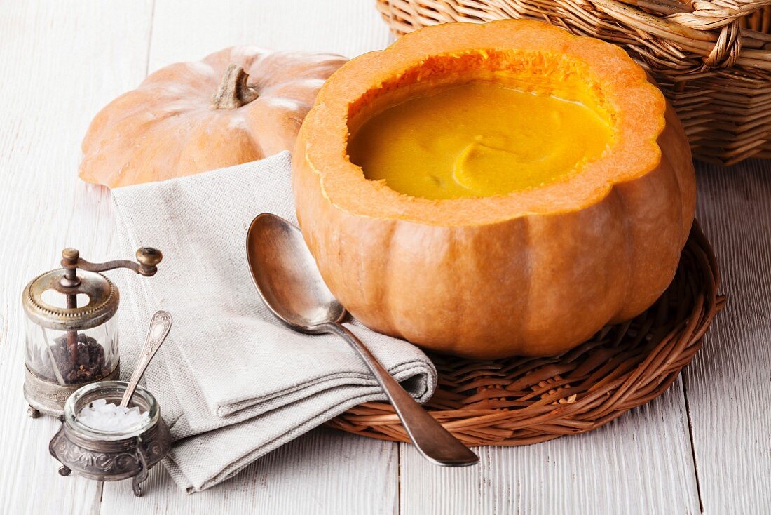 Pumpkin soup in raw pumpkin bowl