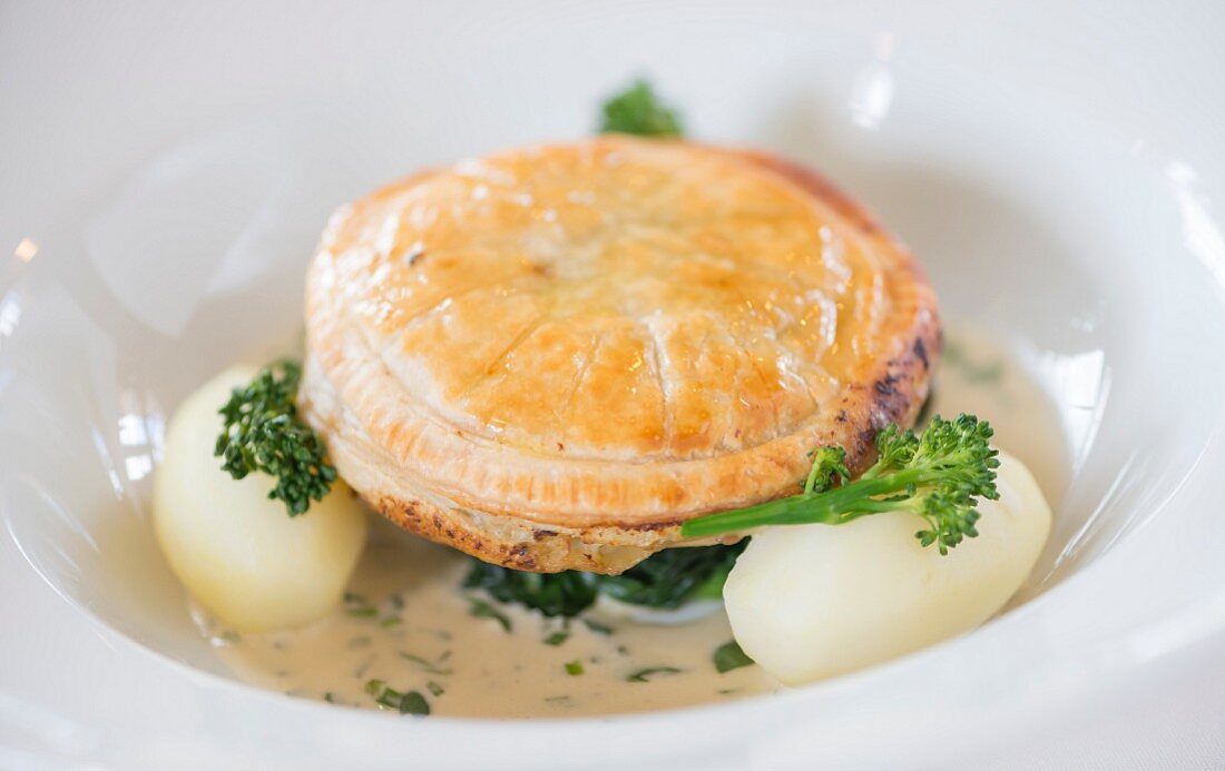 Wild Mushroom Pithivier with butttered spinach and tarragon cream sauce
