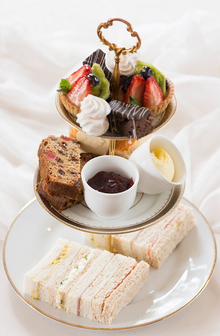 Afternoon tea with cakes, scones and finger sandwiches