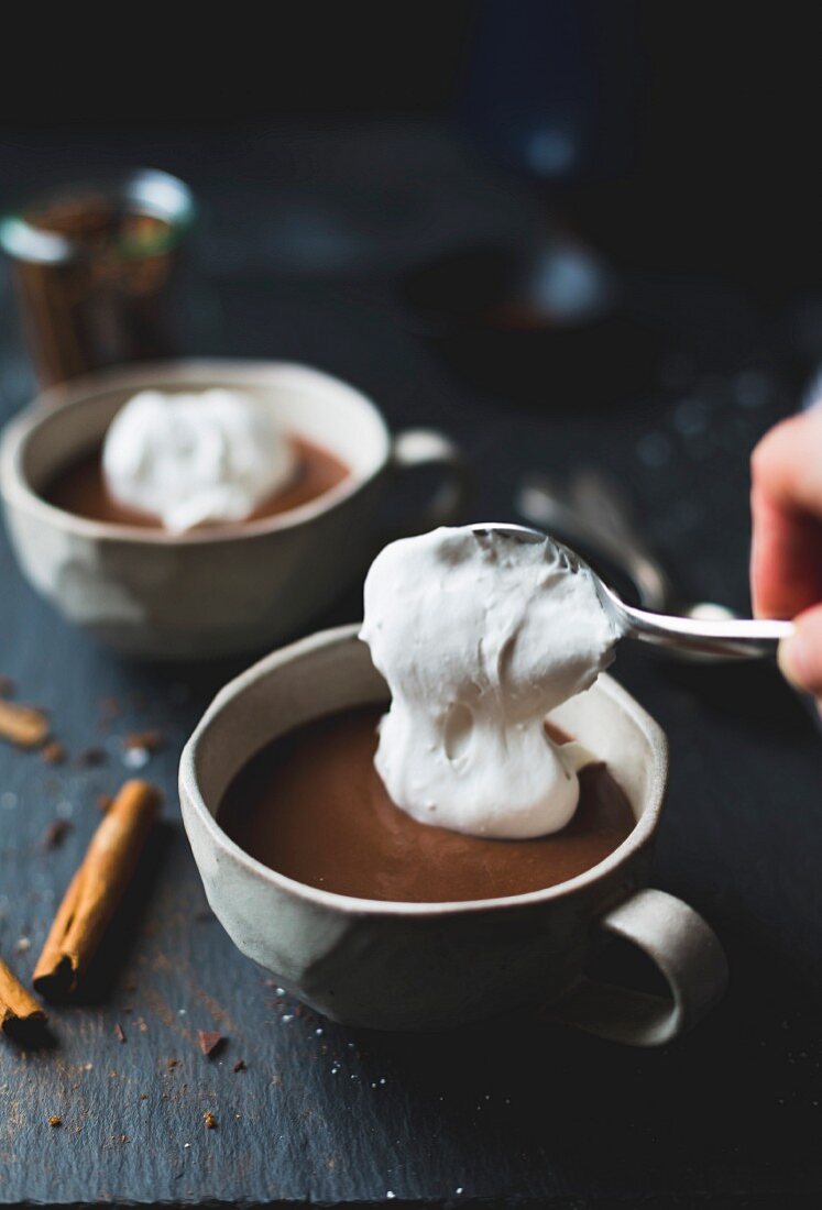 Dairy-free champurrado, almond milk with masa harina and coconut whipped cream