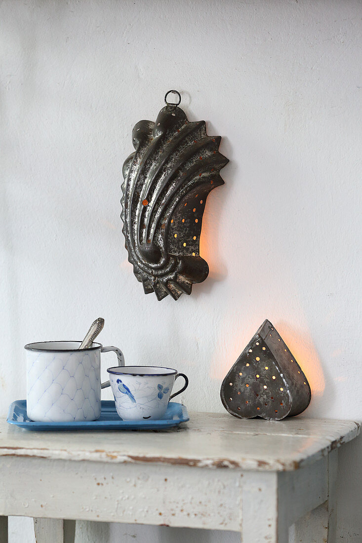 Wall lamp made from old perforated cake tin