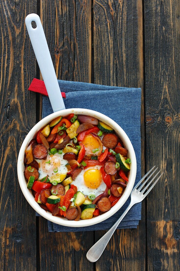 Fried sausage with vegetables and egg