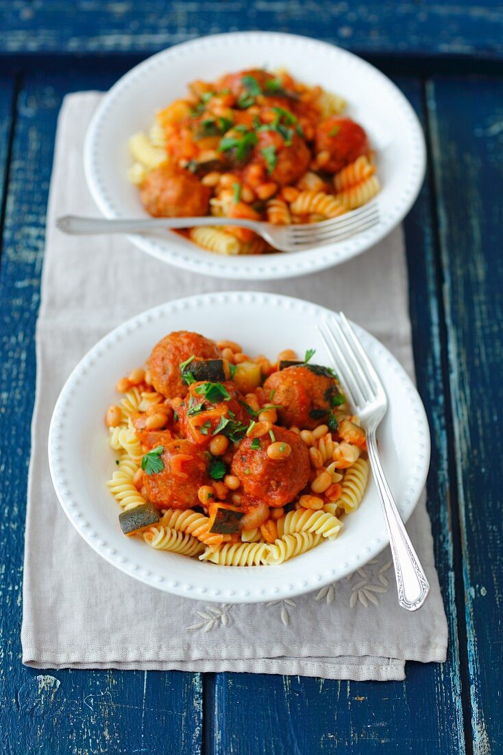 Pasta with meatballs and bean in tomato sauce