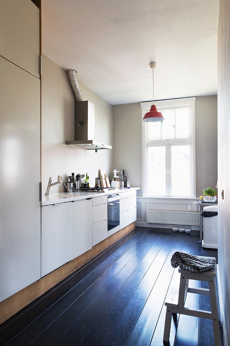 Black board floor in simple kitchen