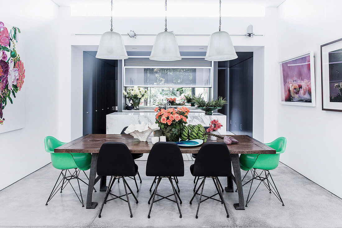 Vintage dining table and classic chairs in the dining area with concrete tiles