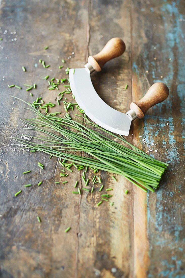 Fresh chives with a herb chopper