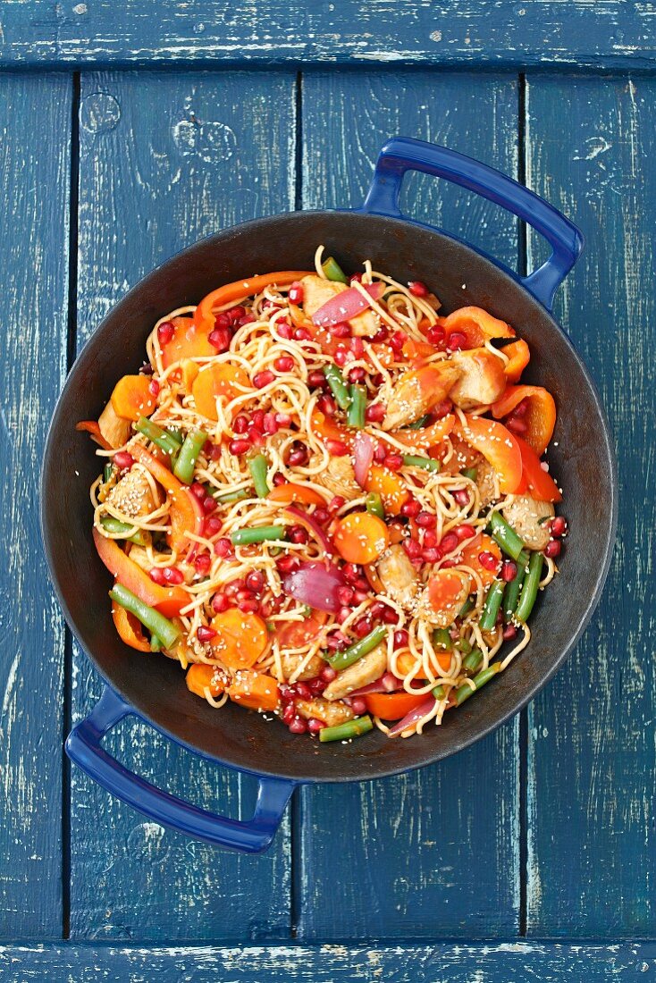 Ramen with chicken, carrot, pepper, bean and pomegranate