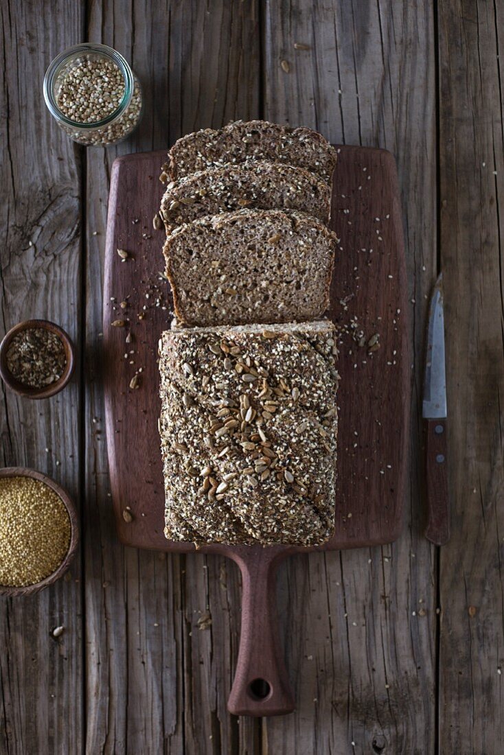 A sliced loaf of homemade buckwheat bread with oats and millet (seen from above)