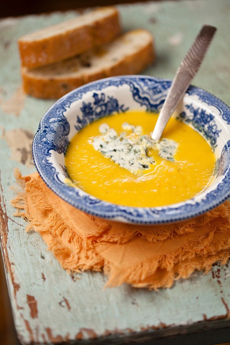 Pumpkin soup in blue bowl