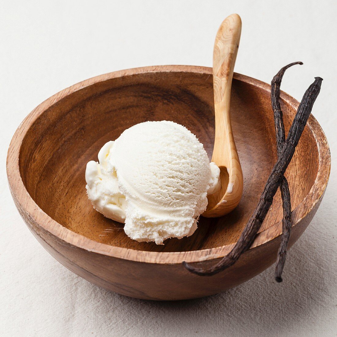 Vanilla ice cream in wooden bowl