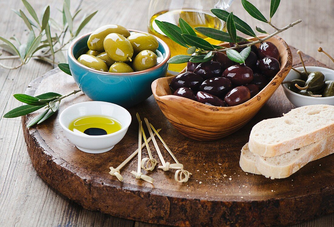 Fresh olives and olive oil platter