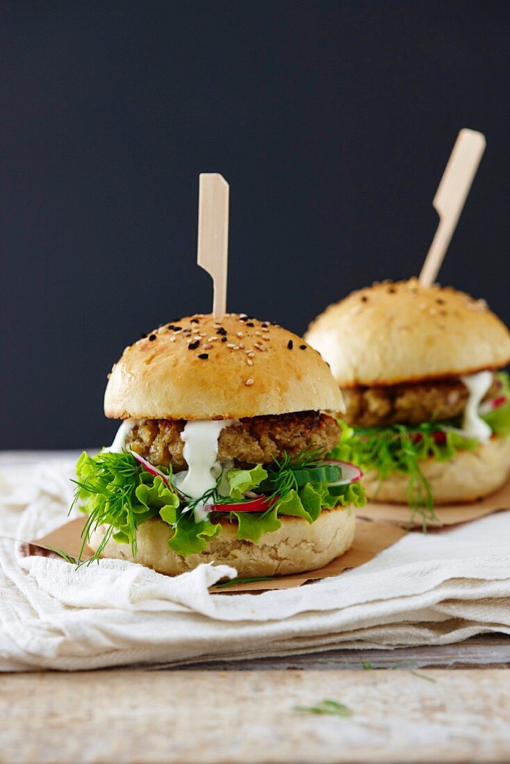 A smorrebrod (buttered rye bread) burger with lettuce and dill