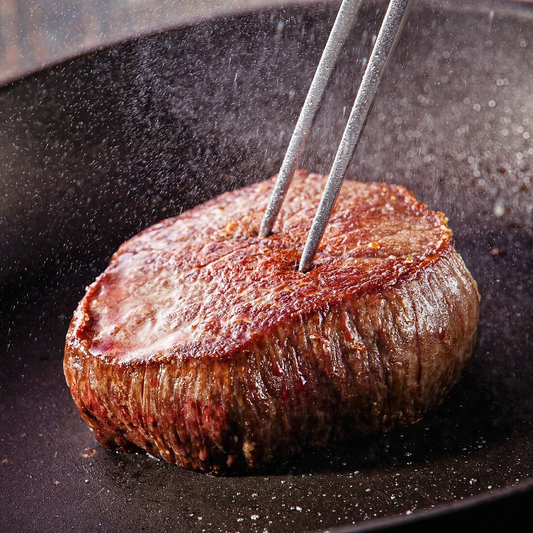 Beef steak fried in pan