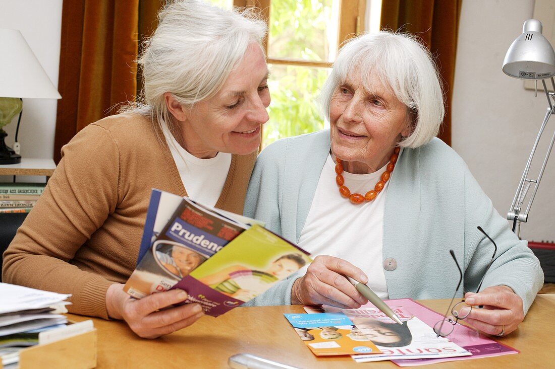 Elderly woman reading leaflet