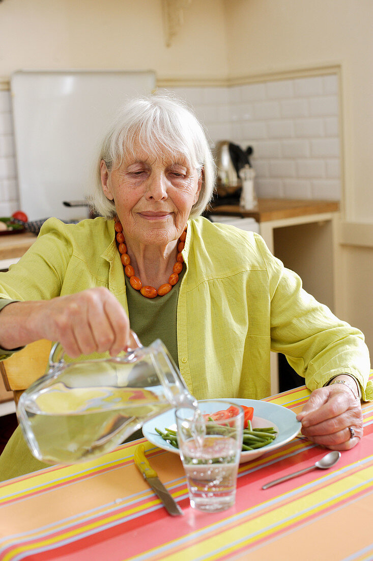 Elderly woman drinking