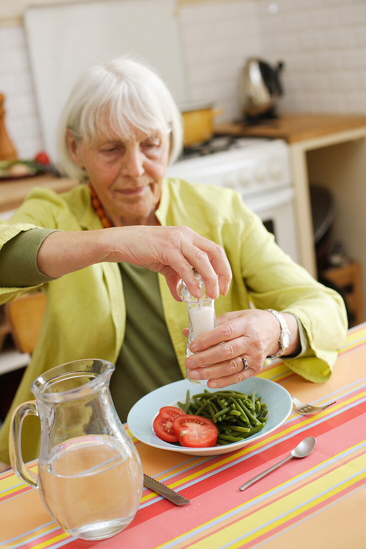 Elderly woman eating