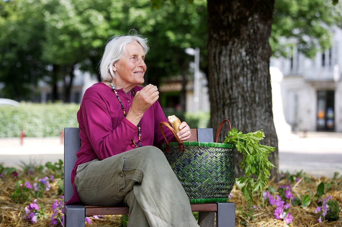 Elderly woman on a bench