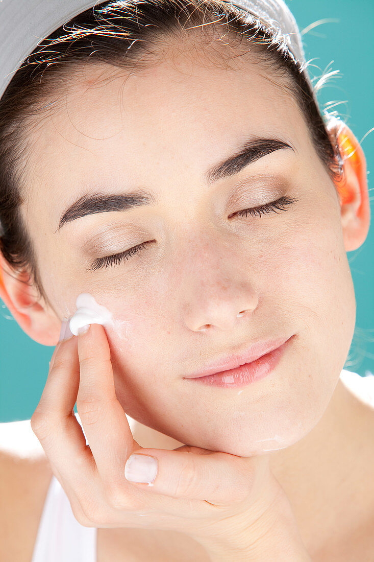 Woman applying cream