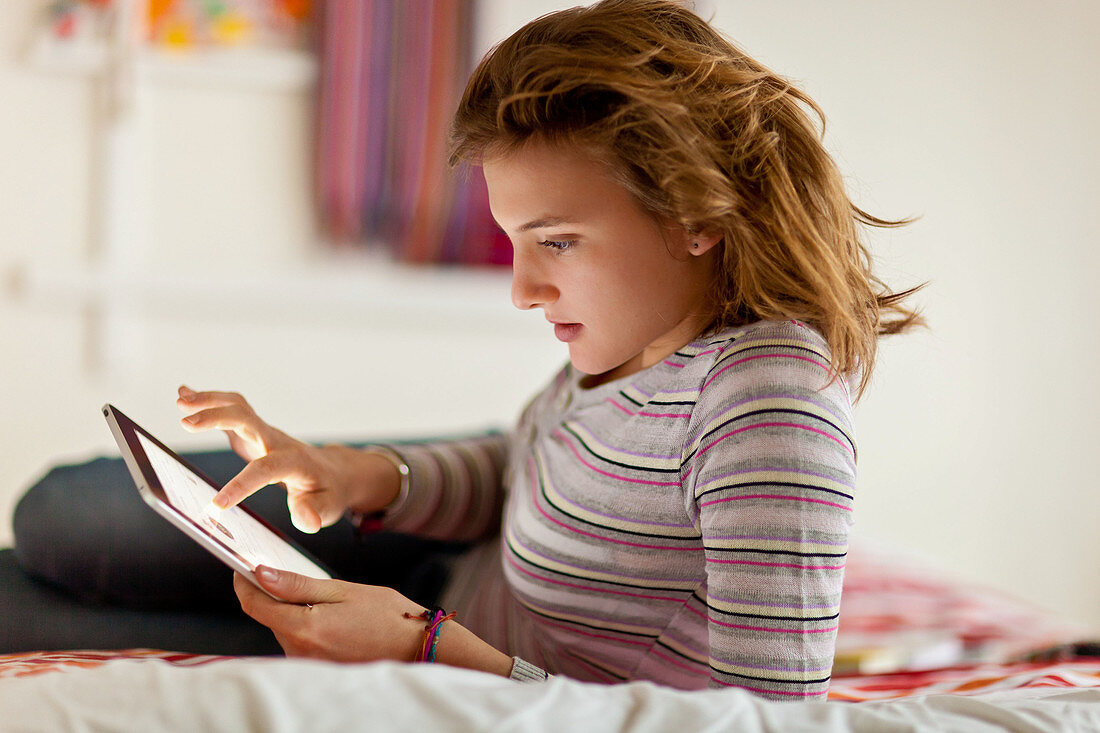 Teenage girl using iPad