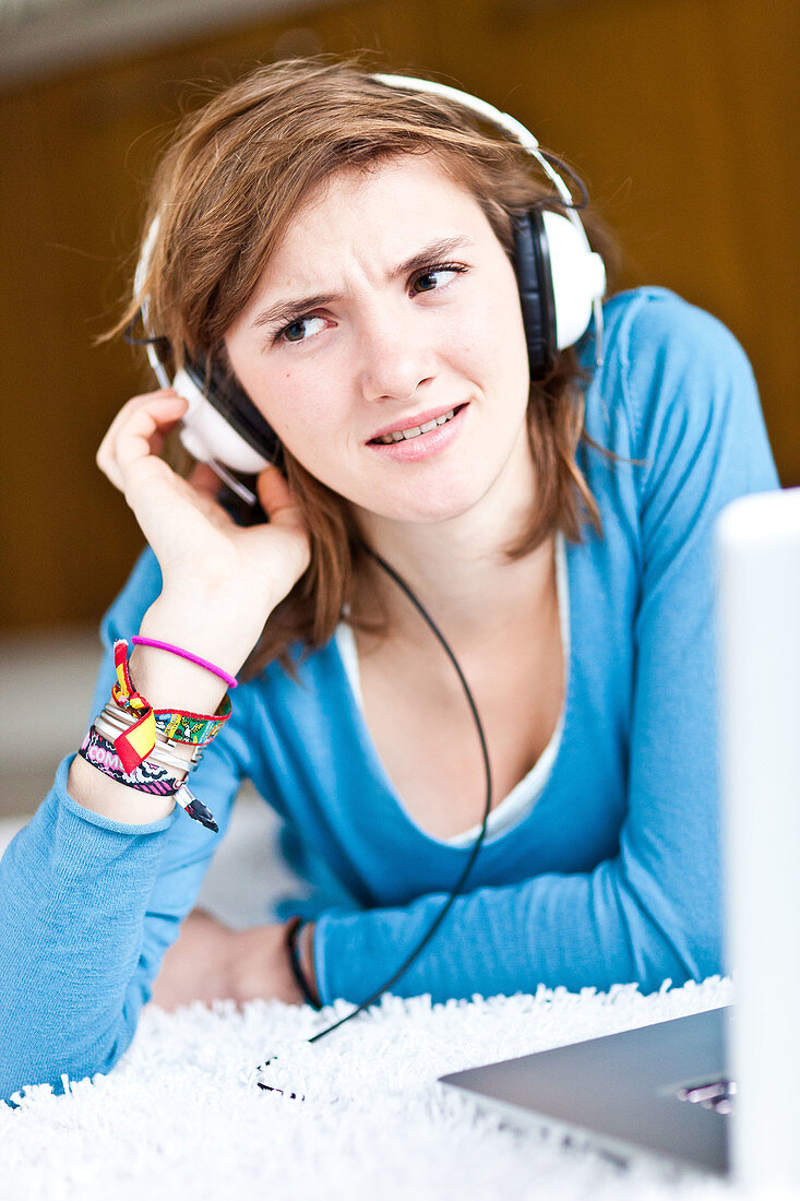 Teenage girl listening to music