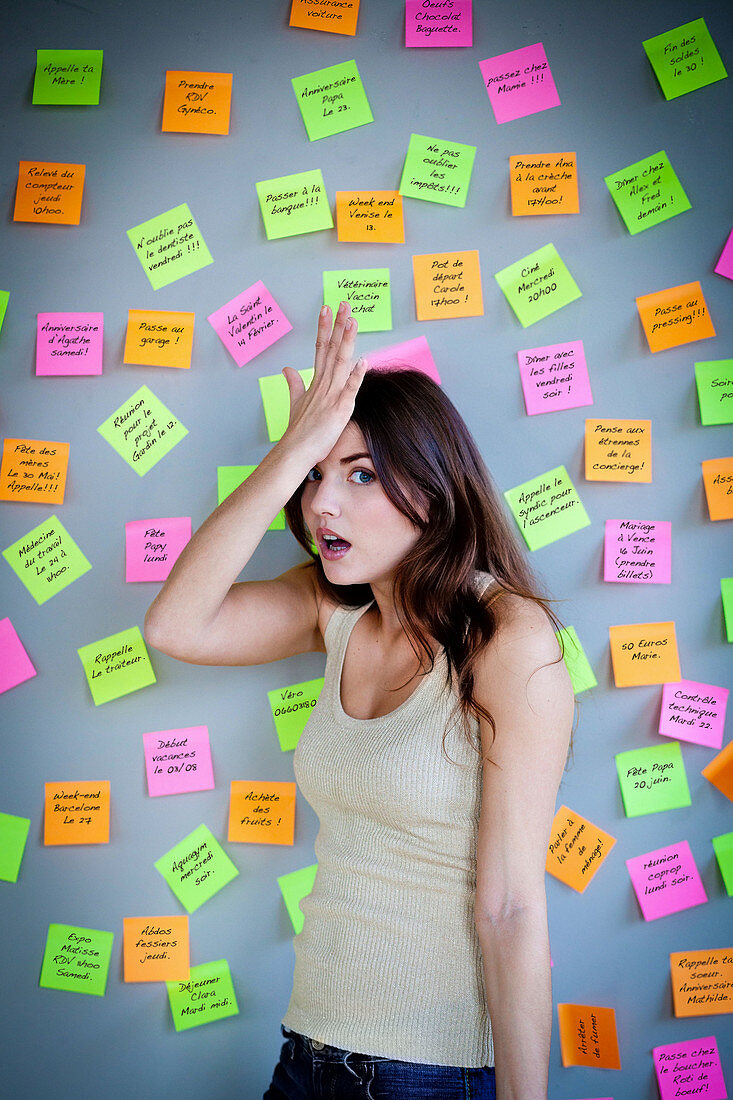 Woman surrounded by post-it notes
