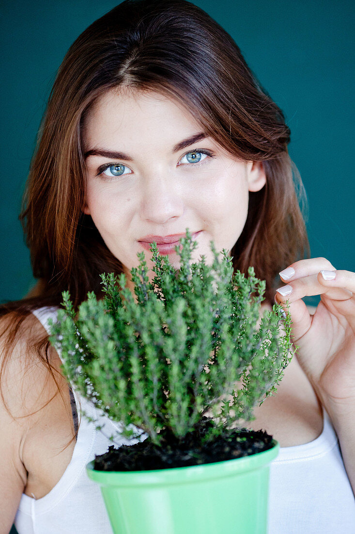 Woman inhaling thyme fragrance