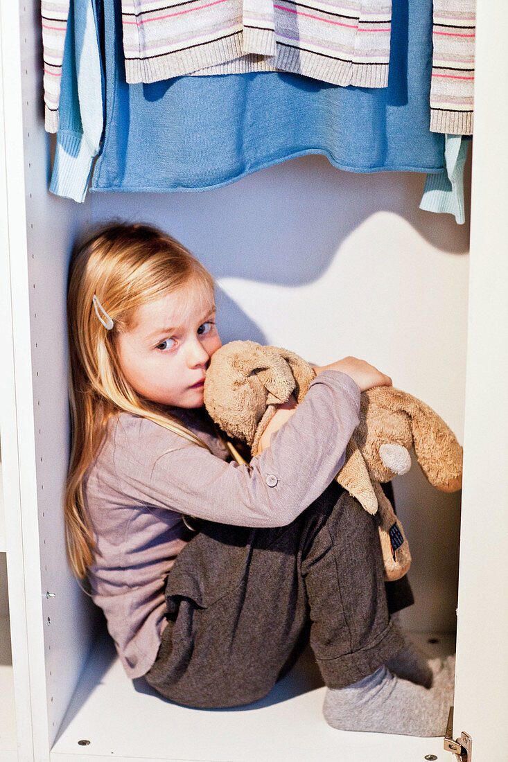 5 year old girl in a closet