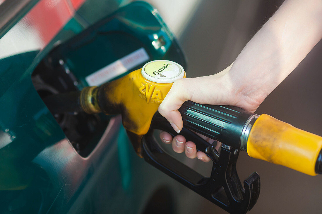 Woman at petrol station