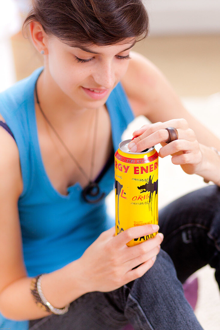 Teenage girl and energy drink