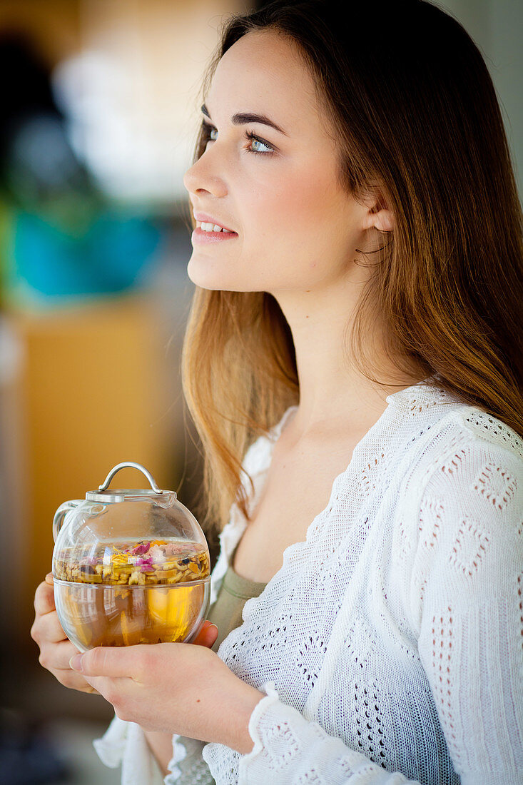 Woman drinking hot beverage