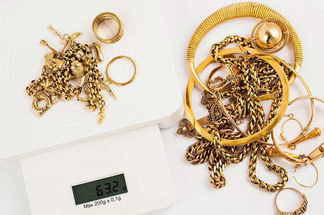 Gold jewellery on a scale