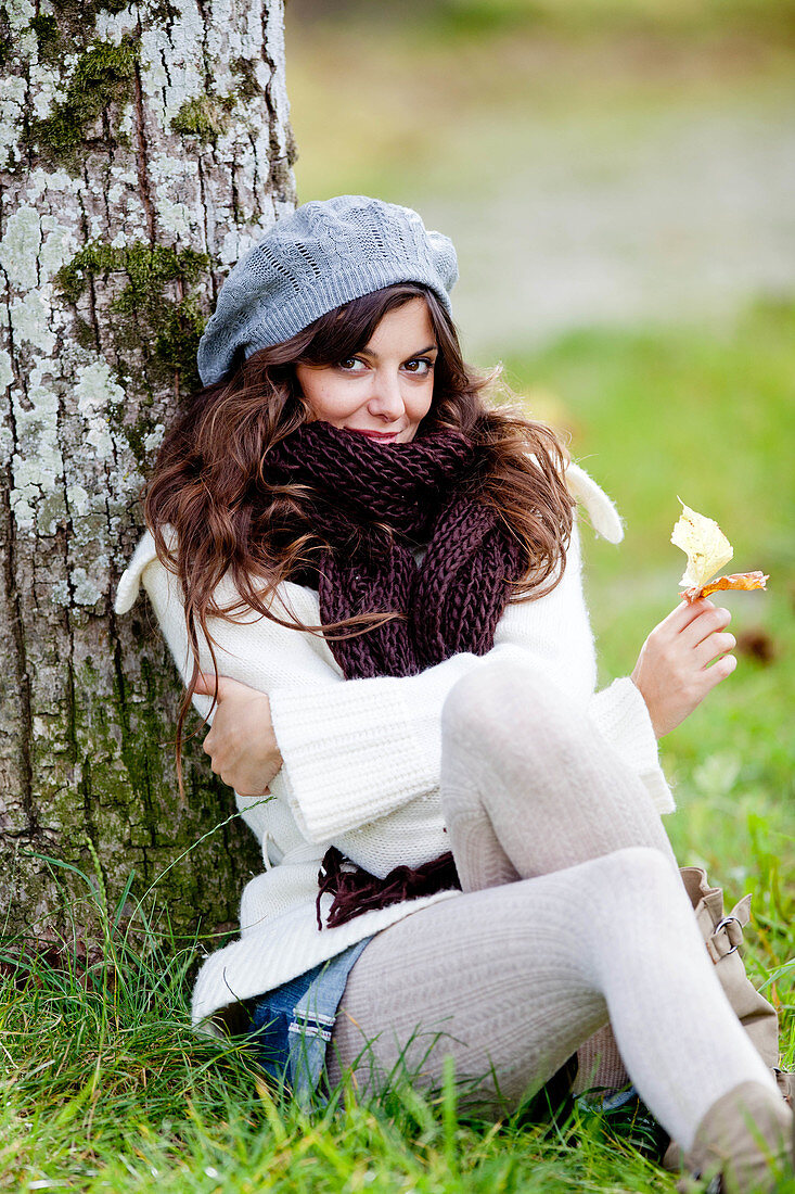 Woman sitting on meadow