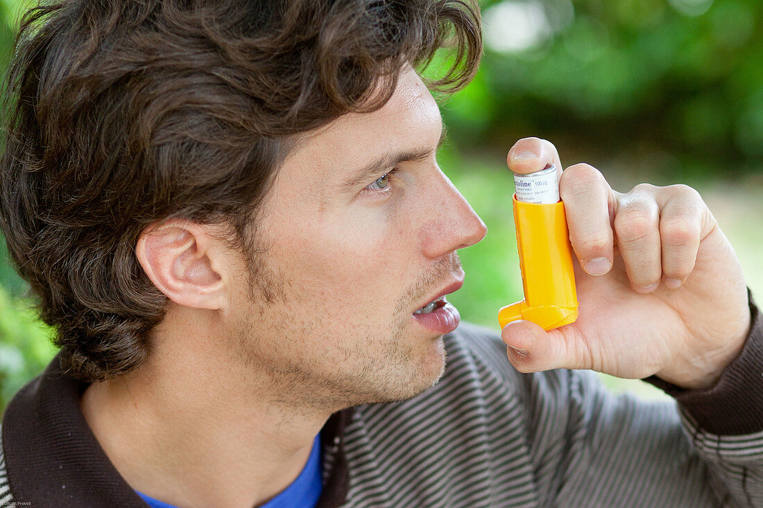 Man using an inhaler