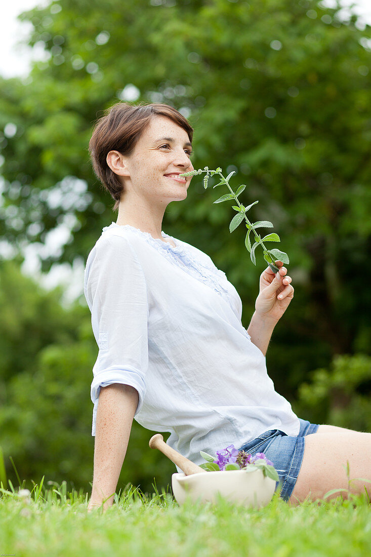 Woman picking plants